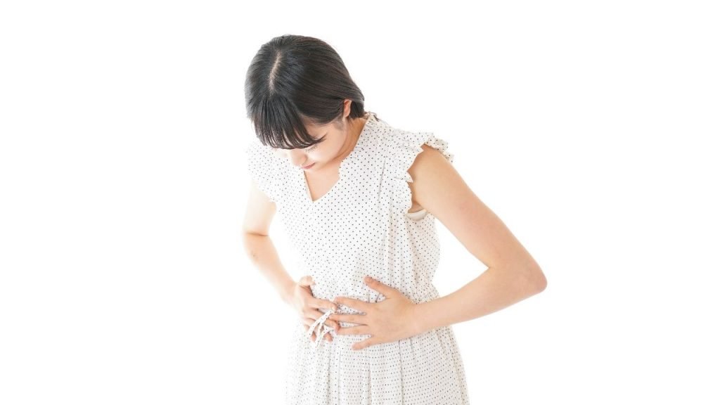 Young woman suffering from 
periumbilical pain
